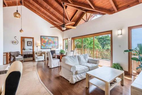 a living room with a couch and a table at Samana Ocean View Villa in Los Grini