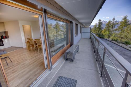 a balcony of a house with a view at Panorama Nid d'Aigle in Nendaz