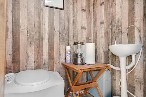 a bathroom with a toilet and a sink at Horizon View Wall Tent - Grand Canyon Luxury Camping Retreat in Valle