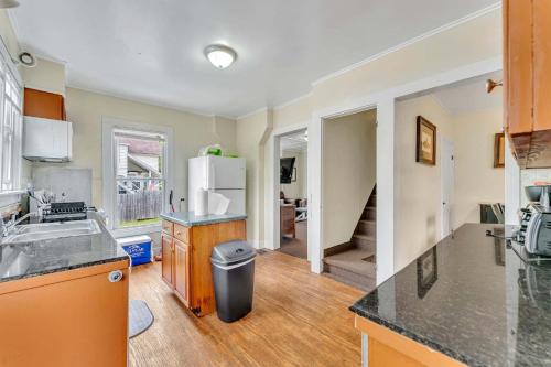 a kitchen with a sink and a refrigerator at Left Field All Star Baseball Rentals in Oneonta