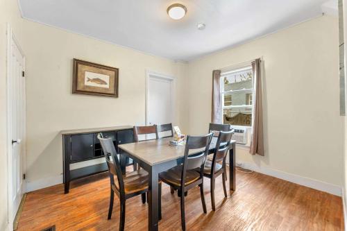 a dining room with a table and chairs at Left Field All Star Baseball Rentals in Oneonta