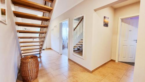 a hallway with stairs in a house at Ferienhaus "Himi" in unmittelbarer Nähe des Passader Sees in Passade