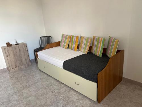 a bedroom with a bed with a wooden frame at Villa Mimì in Ostuni