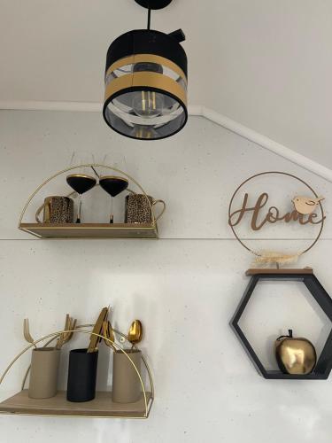 a shelf with a light and a chandelier at Goldy in Neum