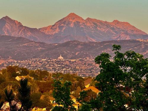 a view of a city with a mountain in the background at Over The River in Riverton