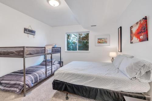 a bedroom with two bunk beds and a window at Over The River in Riverton