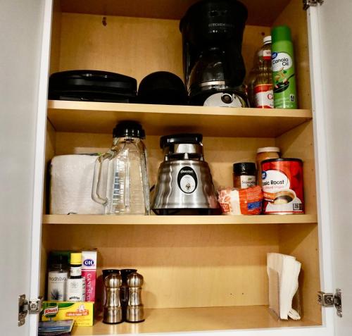 a cupboard filled with lots of kitchen items at Over The River in Riverton