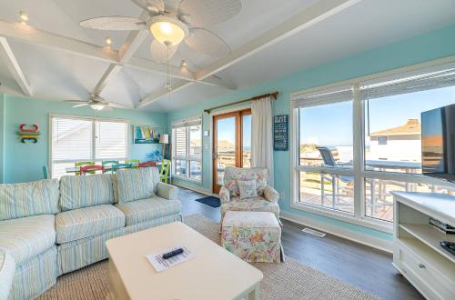 a living room with a couch and a table at Sea II Views in Whalebone