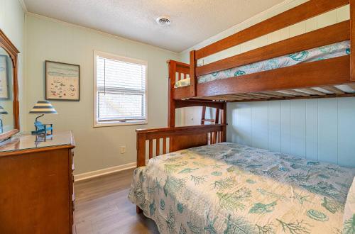 a bedroom with two bunk beds and a desk at Sea II Views in Whalebone