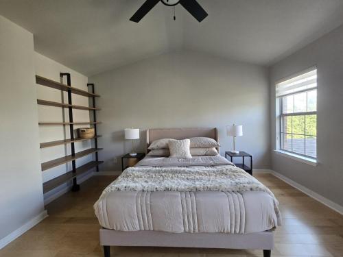 a bedroom with a bed and a ceiling fan at Renovated 4BR 6 Bed 3 and a half Bath Near DFW Airport in Lewisville