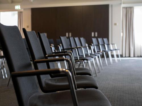 a row of chairs in a conference room at Mercure Hotel Zwolle in Zwolle