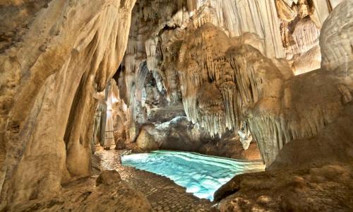 a cave with a river in the middle at Apartamentos Principado de Aracena II in Aracena