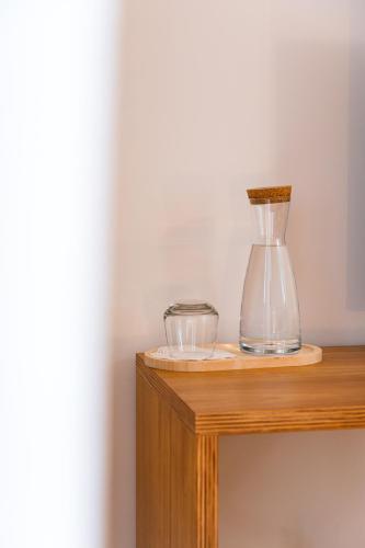 a glass blender sitting on top of a wooden table at Azurara Guesthouse in Azurara