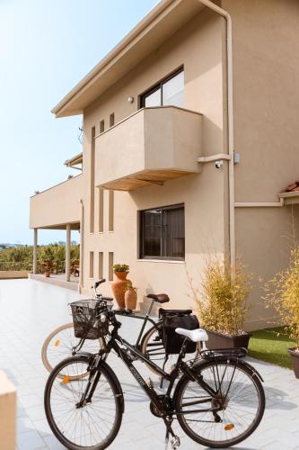 a bike parked in front of a house at Azurara Guesthouse in Azurara
