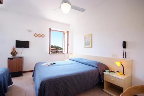 Postel nebo postele na pokoji v ubytování Hotel Anselmi
