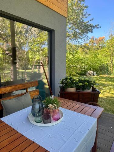 a table with a blue table cloth on a deck at Chatka in Roztiezi in Roztěž