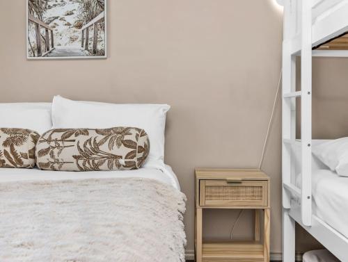 a bedroom with a bunk bed and a bedside table at Tranquil Haven Getaway in Dickies Island