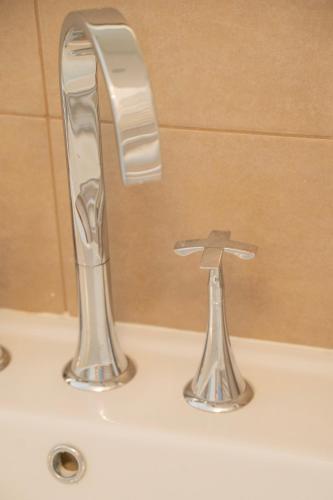 a bathroom sink with a chrome faucet on it at Celestino V in Sulmona