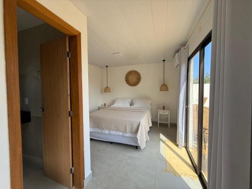 Ένα ή περισσότερα κρεβάτια σε δωμάτιο στο Casa Caiçara Noronha