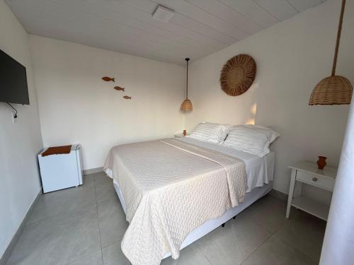 Ένα ή περισσότερα κρεβάτια σε δωμάτιο στο Casa Caiçara Noronha