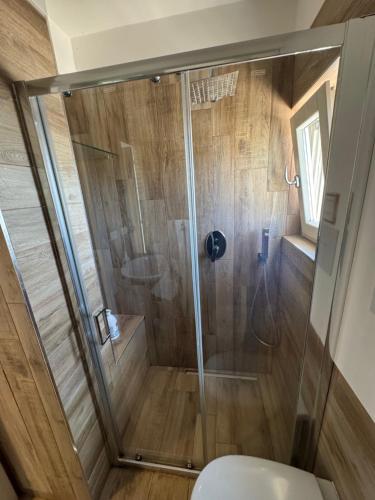 a bathroom with a shower with a toilet at La Suite del Mare in Taranto