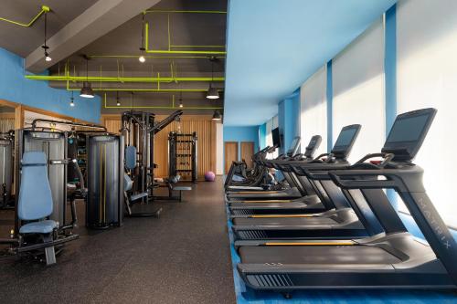 a row of treadmills and machines in a gym at Dreams Cap Cana Resort & Spa - All Inclusive in Punta Cana