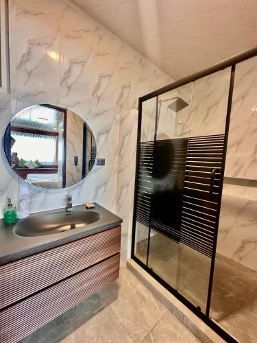 a bathroom with a sink and a mirror at Kaway Resort & Spa in Tabuelan