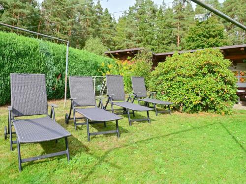 a group of chairs sitting in the grass at Bärenhöhle in Marktleuthen