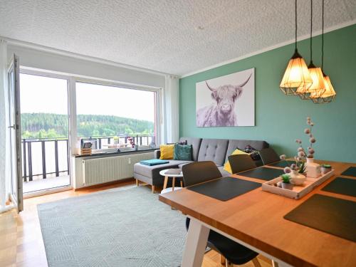 a living room with a couch and a table at Bärenhöhle in Marktleuthen
