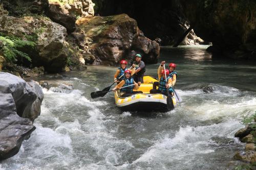 a group of people on a raft in a river at Il Borgo Ospitale - Albergo Diffuso in Rotonda