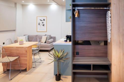 a living room with a door leading to a dining room at Evis Cosmos 1 - Meno Homes 10 in Xanthi