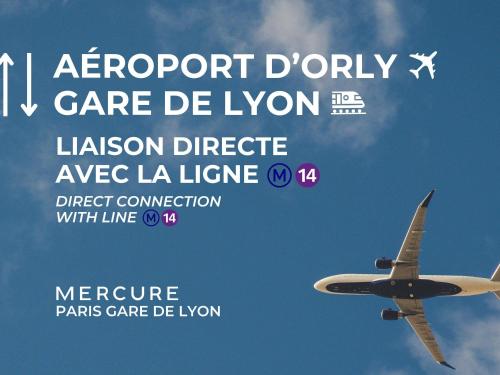 an airplane is flying in the sky at Mercure Paris Gare De Lyon TGV in Paris