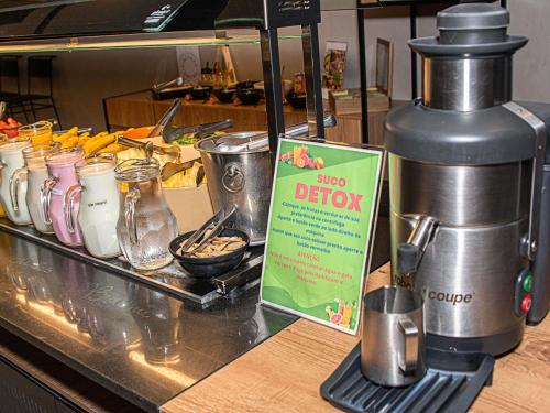 a coffee machine sitting on top of a counter at ibis Sao Paulo Barra Funda in Sao Paulo