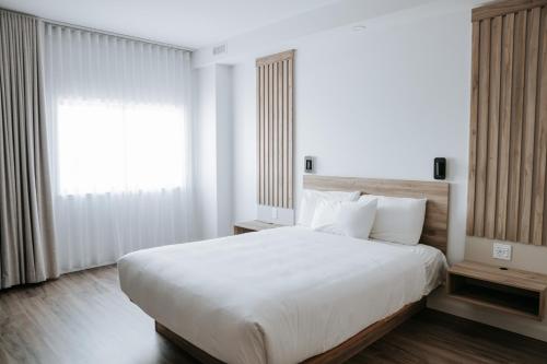 Postel nebo postele na pokoji v ubytování Hotel Universel Alma