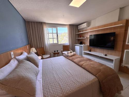 Postel nebo postele na pokoji v ubytování Estúdio Moderno na Granja Brasil – Itaipava