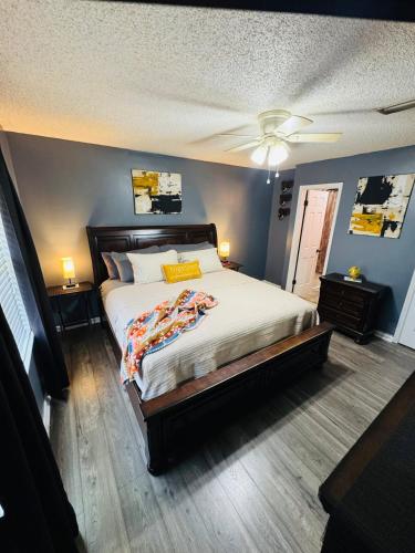 a bedroom with a bed and a ceiling fan at Home Away from Home in Fitzgerald