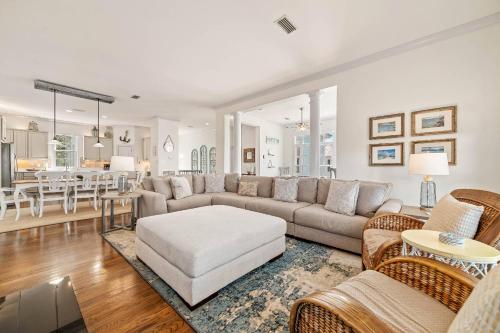 a living room with a couch and a table at Sandy Gull Too in Orange Beach