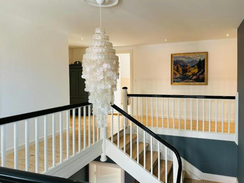 a chandelier in the hallway of a home at Large Holiday Home With Pool On South Lolland Coast in Dannemare