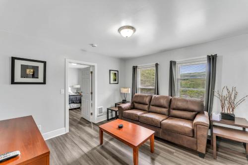 a living room with a couch and a table at Pitcher's Paradise Apt 3 All Star Baseball Rentals in Oneonta