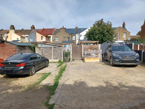 two cars parked in the driveway of a house at The Maple in Grays Thurrock