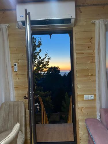 a view from the living room of a tiny house at cozy cottage in chakvi in Itʼkhvisi