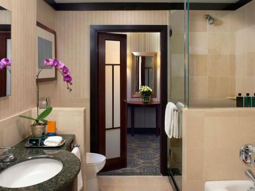 a bathroom with a sink and a toilet and a shower at Sofitel Philadelphia at Rittenhouse Square in Philadelphia