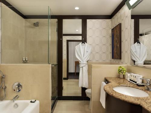 a bathroom with a sink and a shower and a toilet at Sofitel Philadelphia at Rittenhouse Square in Philadelphia