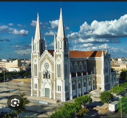 a large white church with two towers on top at flet para temporadas in Petrolina