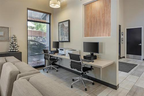 an office with a desk with a computer and a couch at Best Western Plus Zion Canyon Inn & Suites in Springdale