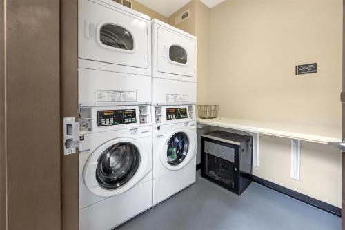 a laundry room with three washers and a dryer at Best Western Plus Zion Canyon Inn & Suites in Springdale