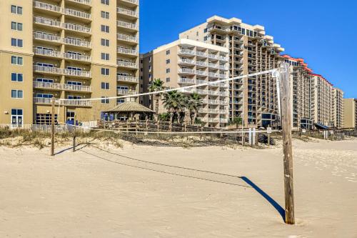 a volleyball net on the beach in front of buildings at Escapes to the Shores 1101 in Orange Beach