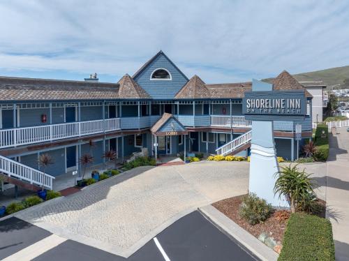 a building with a sign that readsshoreline inn at Shoreline Inn...on the beach in Cayucos