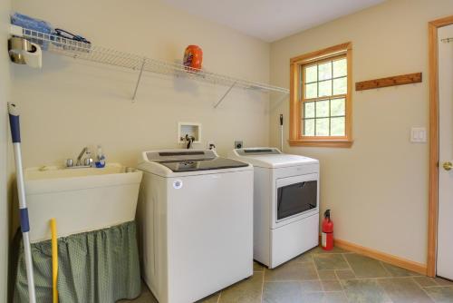 a kitchen with a washing machine and a sink at Rustic North Creek Getaway about 4 Mi to Gore Mtn! in North Creek