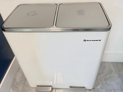 a white refrigerator freezer sitting on top of a floor at Comfort Meets Convenience in Schaumburg